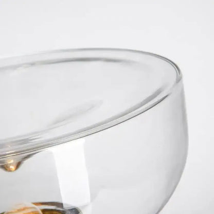 Modern clear glass aella table lamp with smooth rounded rim and golden accents for bedroom office decorbites aella table