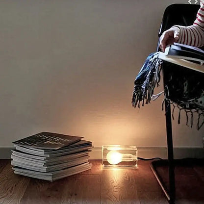 Modern clear glass cube led table lamp with glowing incandescent bulb for bedroom nightlight use