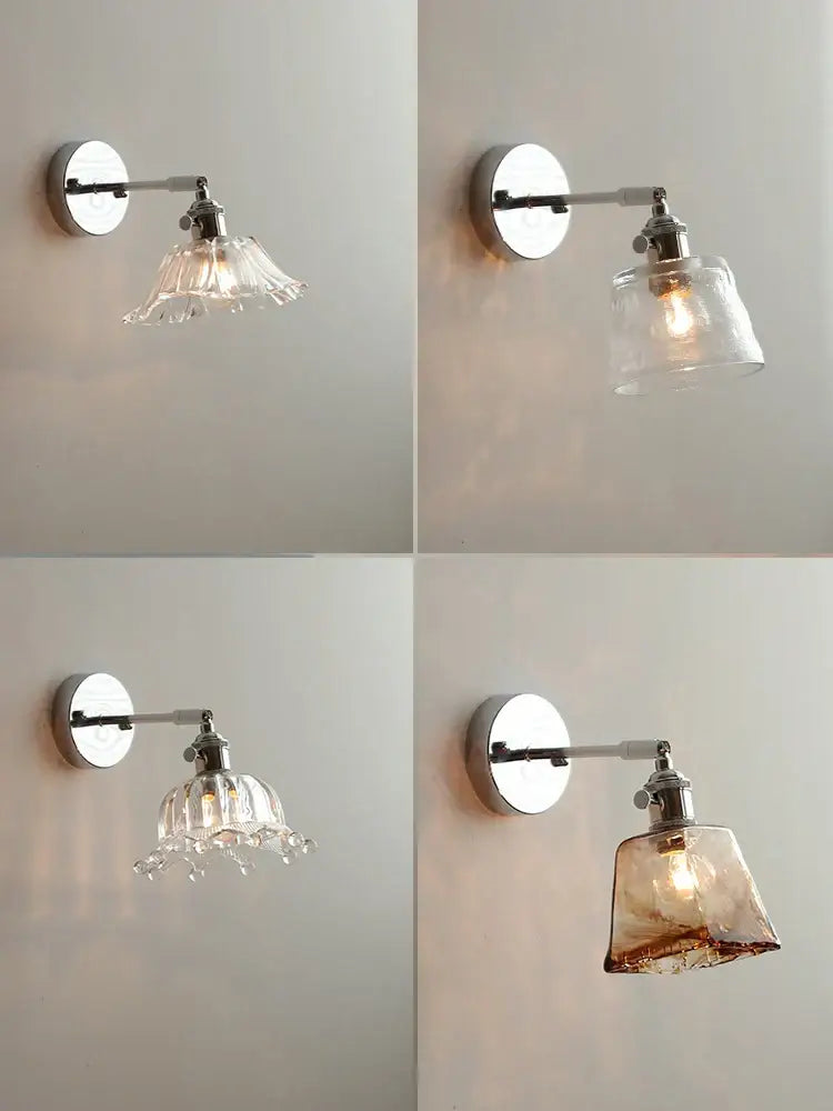 Set of four vintage-style wall lamps with chrome arms and decorbites clear glass shades in multiple designs