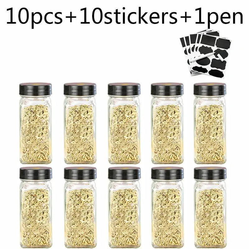 Modern clear glass seasoning jar set with ten clear glass seasoning jars with black lids filled with dried herbs