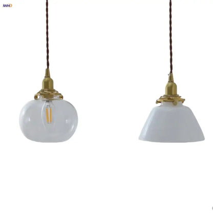 Two vintage-style led pendant lamps with clear glass and white ceramic globes, brass fixtures, and twisted brown cords