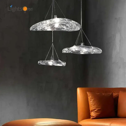 Modern clear hand-blown glass staircase pendant light with swirling organic design for dining room illumination