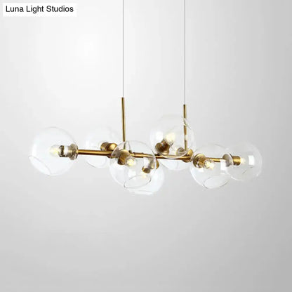Modern black and gold lighting fixture with clear smoke glass globe shades and eight bulbs for dining room use