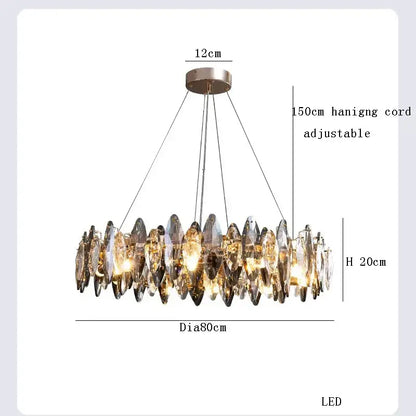 A modern clear and smoky decorbites crystal led chandelier with faceted crystal pendants in a circular metallic mount