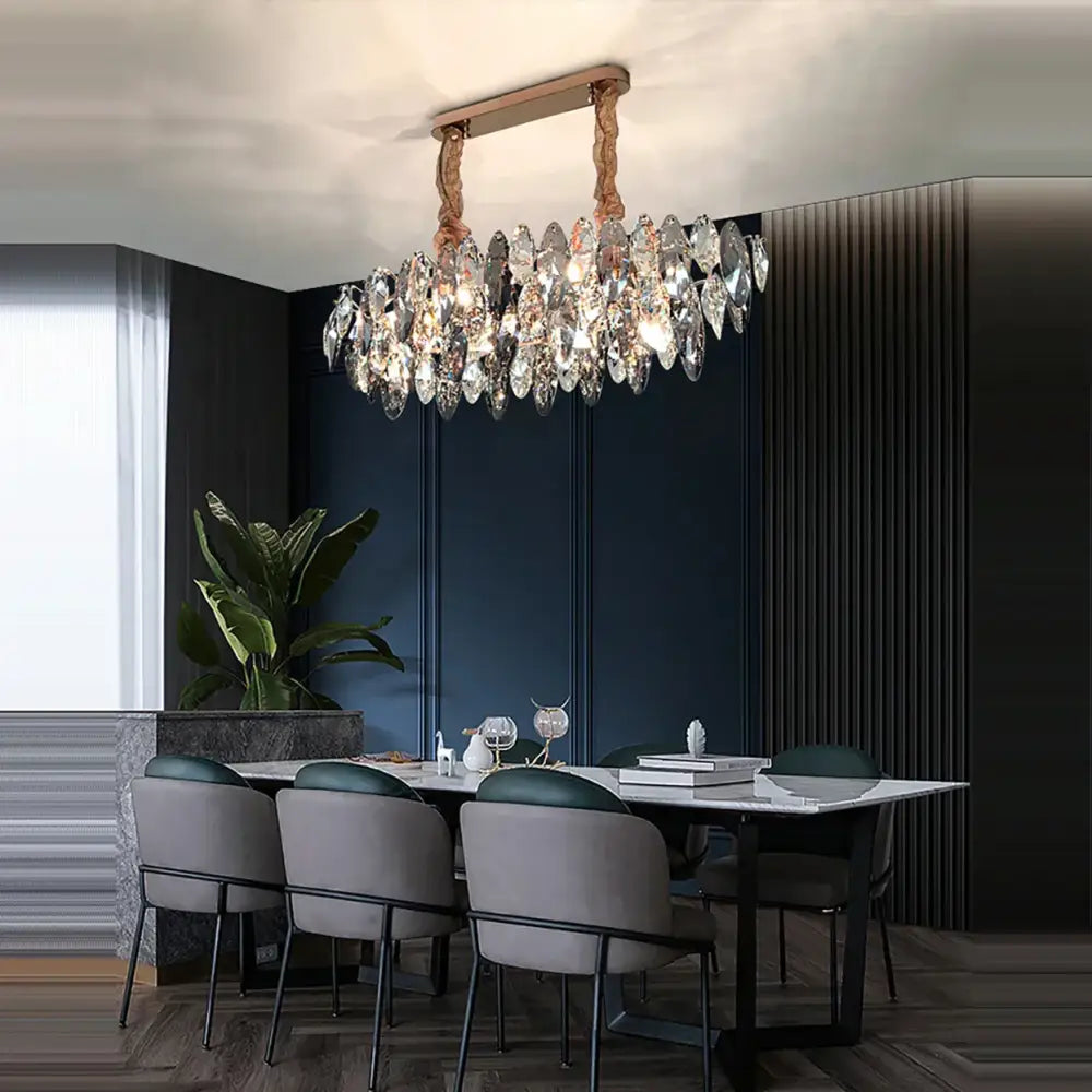 A modern crystal led chandelier with a rose gold frame and clear teardrop pendants for living room decorbites crystal led