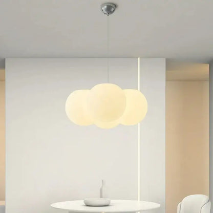 A modern cloud glass ball milky white pendant light with three off-white glass ball milky bulbs for living room decorbites