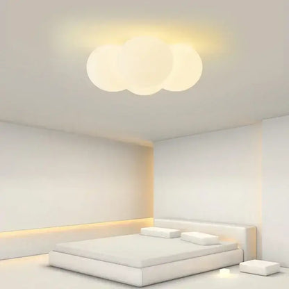 A modern three-lobed cloud glass ball milky white chandelier with a soft translucent finish for living room decorbites