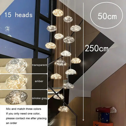 A modern 15-head crystal pendant chandelier with transparent amber and smoke gray glass as a dining room focal point