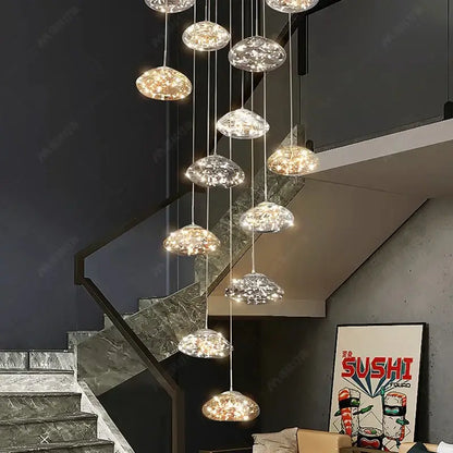 Modern cloud glass crystal pendant chandelier with multiple warm glowing crystal pendants as a dining room focal point