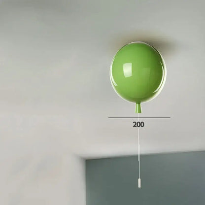 Modern colorful lime green balloon acrylic ceiling light with a glossy finish and white pull cord for kids bedroom