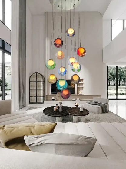 A modern colorful balls chandelier by decorbites features translucent glass orbs suspended for dining room decor
