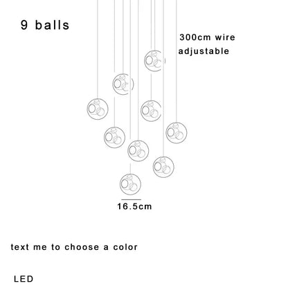 Modern colorful balls chandelier featuring nine clear glass spherical led pendant lights with circular rings by decorbites colorful balls