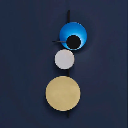 Modern colorful geometric led wall lamp with three stacked shades in blue matte white and warm gold for bedroom decor