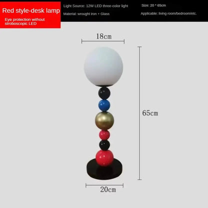 Modern colorful glass ball floor lamp with a red base and white glass globe shade for living room use