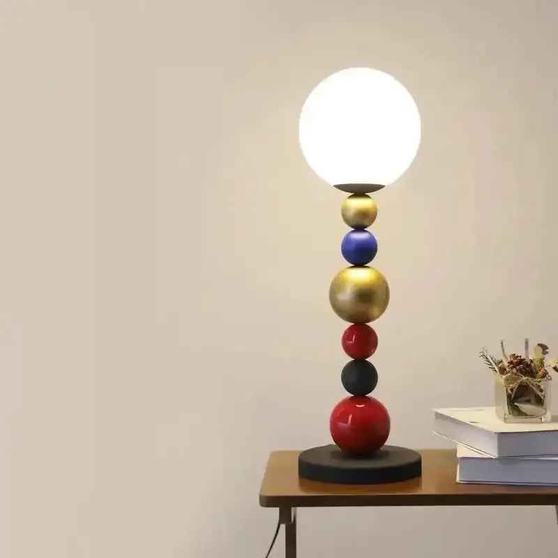 Modern colorful glass ball floor lamp with glossy gold, blue, red, black spheres and white globe shade for living room