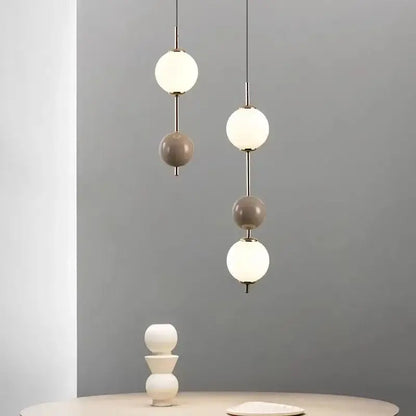 Modern colorful glass ball led pendant light featuring white and matte gray spherical glass shades for dining room decorbites pendant light