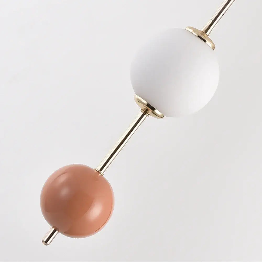 Modern colorful glass ball led pendant light with matte white and warm terracotta orbs by decorbites for dining room decor