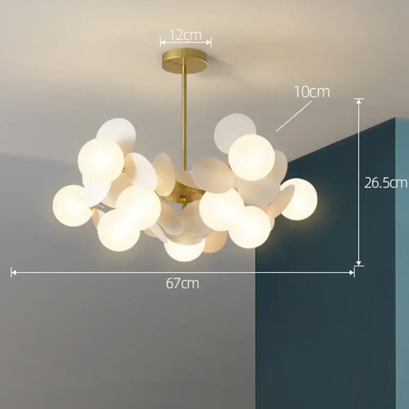 Gold-toned modern decorbites branch chandelier with frosted glass orbs in a cluster design for living room decor