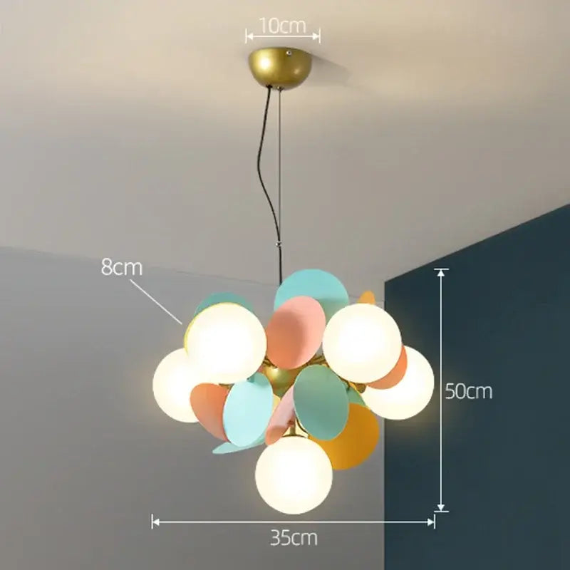 A modern colorful glass decorbites branch chandelier with frosted bulbs and pastel discs for living room decor