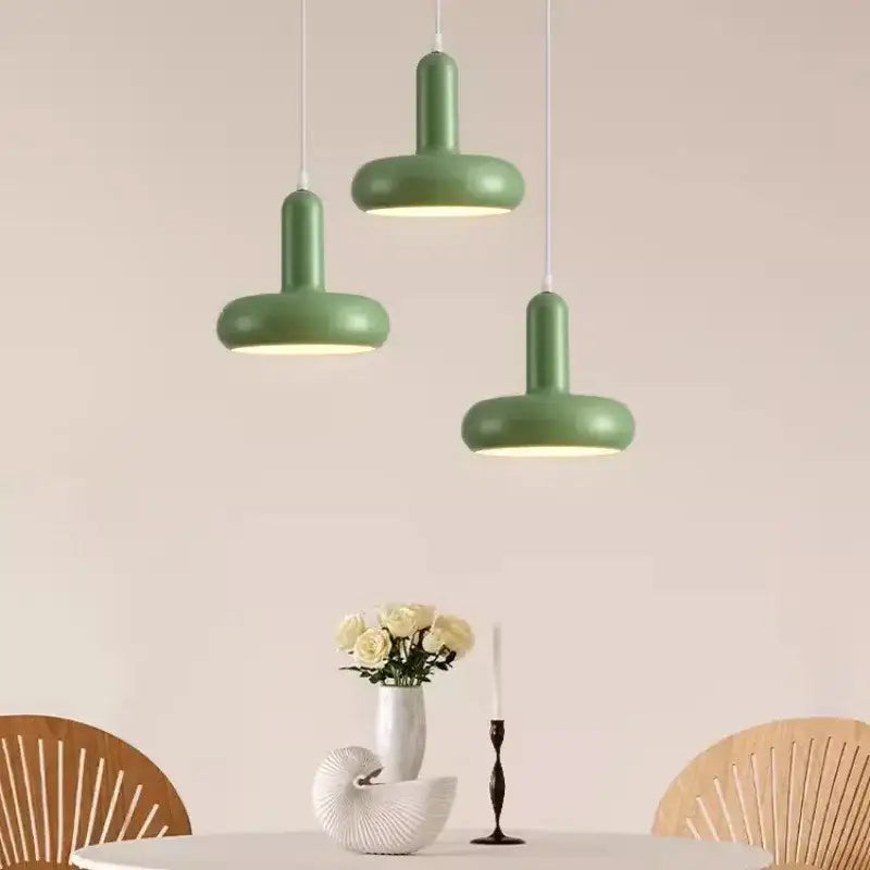 Three modern green painted aluminum pendant lights with matte aluminum finish for kitchen and dining room