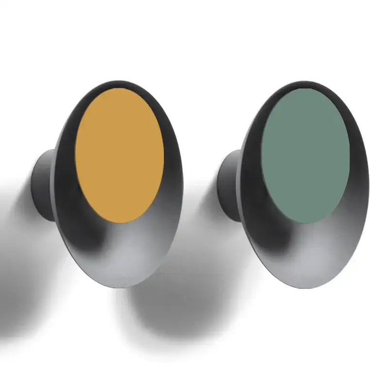 Modern colorful rotatable led wall lamp with matte black frame and mustard yellow and sage green inserts for bedroom use