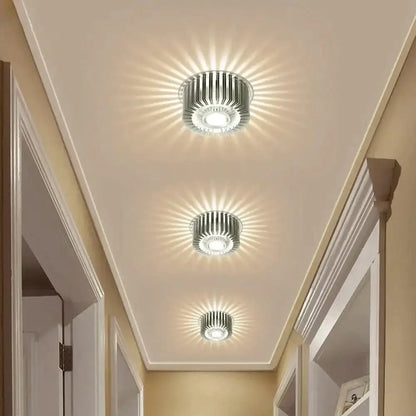 Three metallic modern recessed ceiling lights with radial light patterns for indoor LED decor and gallery lighting
