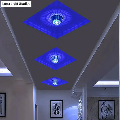 Three diamond-shaped blue illuminated modern ceiling lights with central circular fixture for recessed ceiling use