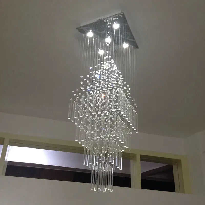 Modern columnar crystal chandelier with sleek triangular metal fixture and cascading clear glass beads for white living room decorbites columnar crystal design