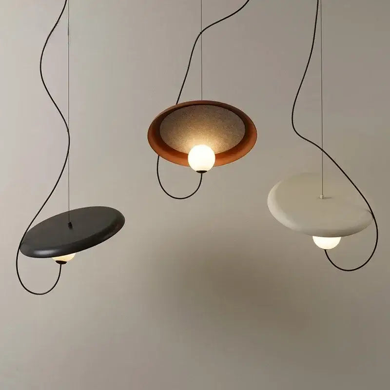 Modern copper and black grid color led pendant light with three matte black, warm brown, and off-white circular shades