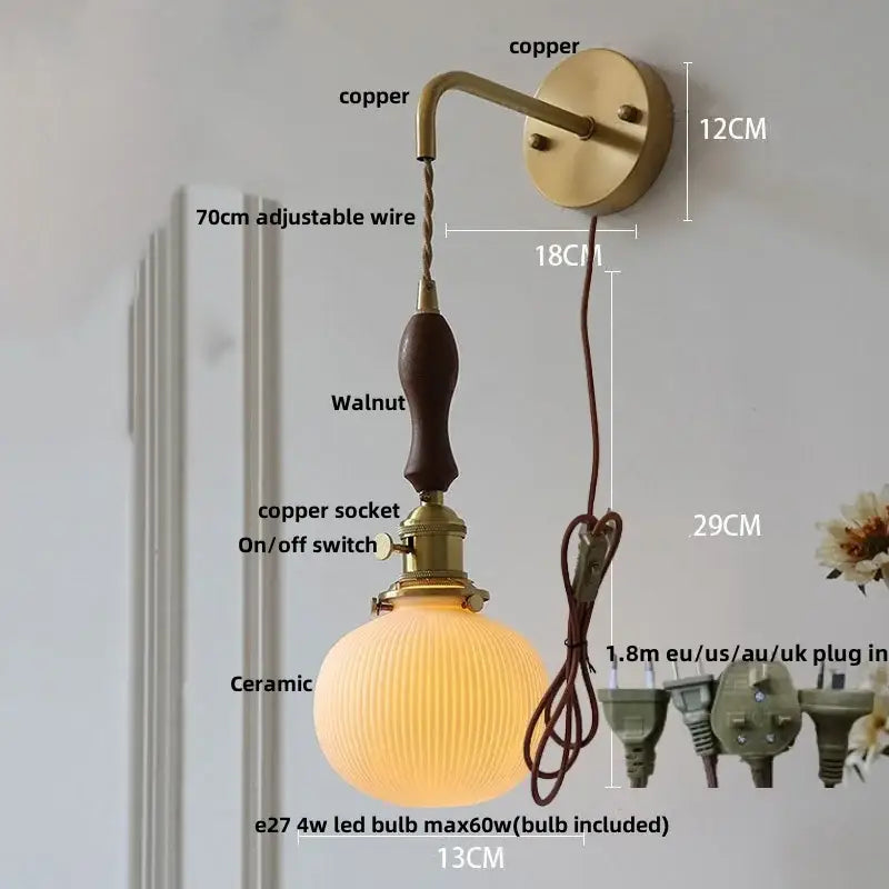 Modern copper wall light fixture with walnut handle, ceramic globe shade, and adjustable wire for bedroom use