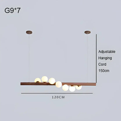 Modern minimalist pendant light with burly wood walnut bar and seven frosted glass globes for living room decorbites