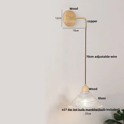 Modern copper and wood wall sconce with natural wood base, copper arm, clear glass shade, and pull chain switch