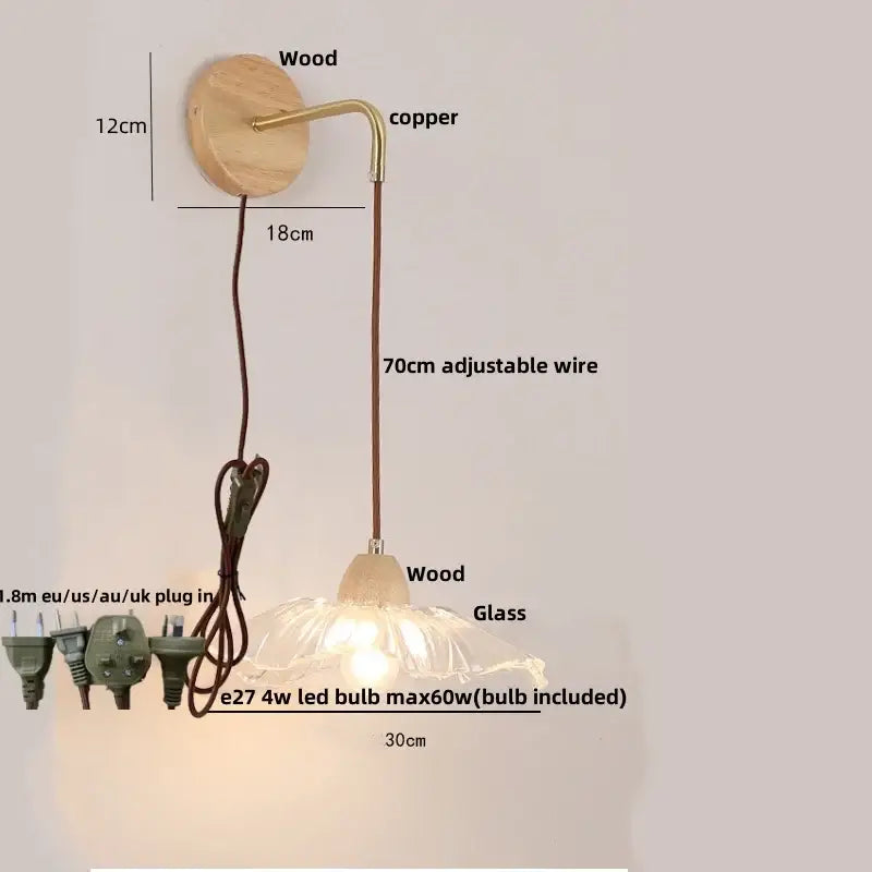 Modern copper and wood wall sconce with clear glass shade and pull chain switch for easy lighting control