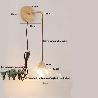 Modern copper and wood wall sconce with clear glass shade and pull chain switch for easy lighting control
