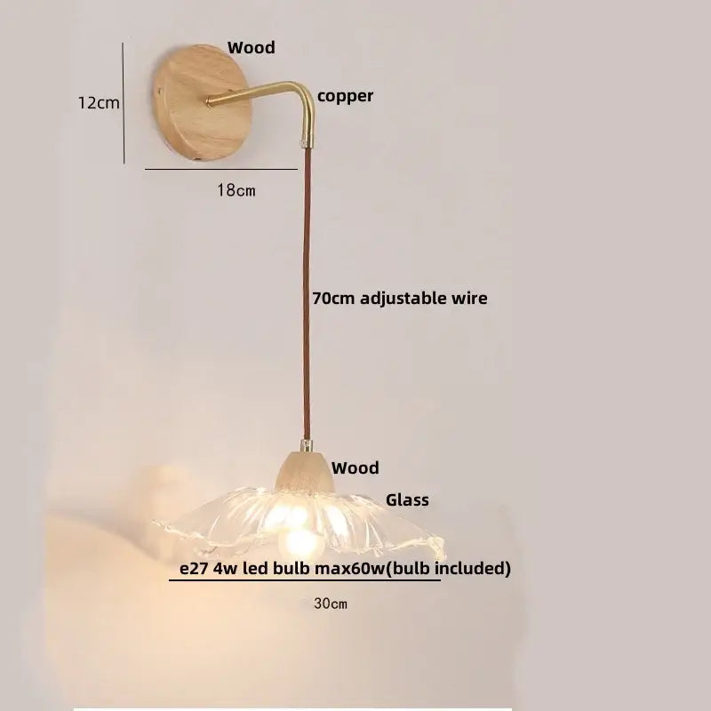 Modern copper and wood wall sconce with clear glass flower-shaped lampshade and warm glow pull chain switch