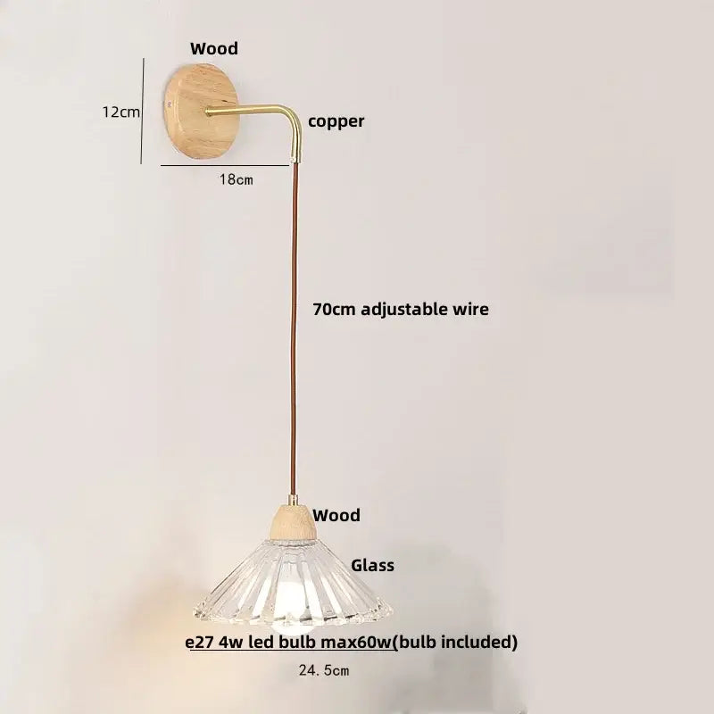 Modern copper and wood wall sconce with clear glass faceted lampshade and pull chain switch on wooden base