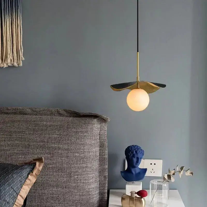 Modern decorbites copper bedside chandelier with gold-toned metal stem leaf shade and illuminated marble ball bulb