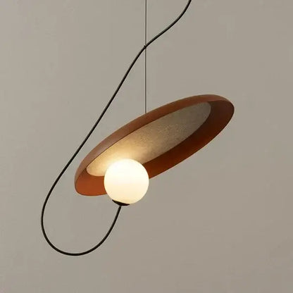 Modern copper decorbites grid color pendant light with warm matte circular shade and glowing bulb for dining room use