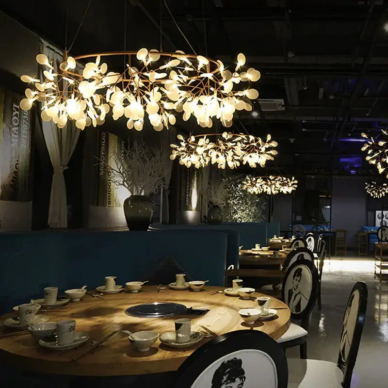 A modern copper heracleum chandelier with gold-toned metal branches and frosted glass leaf lights for dining room decorbites heracleum chandelier