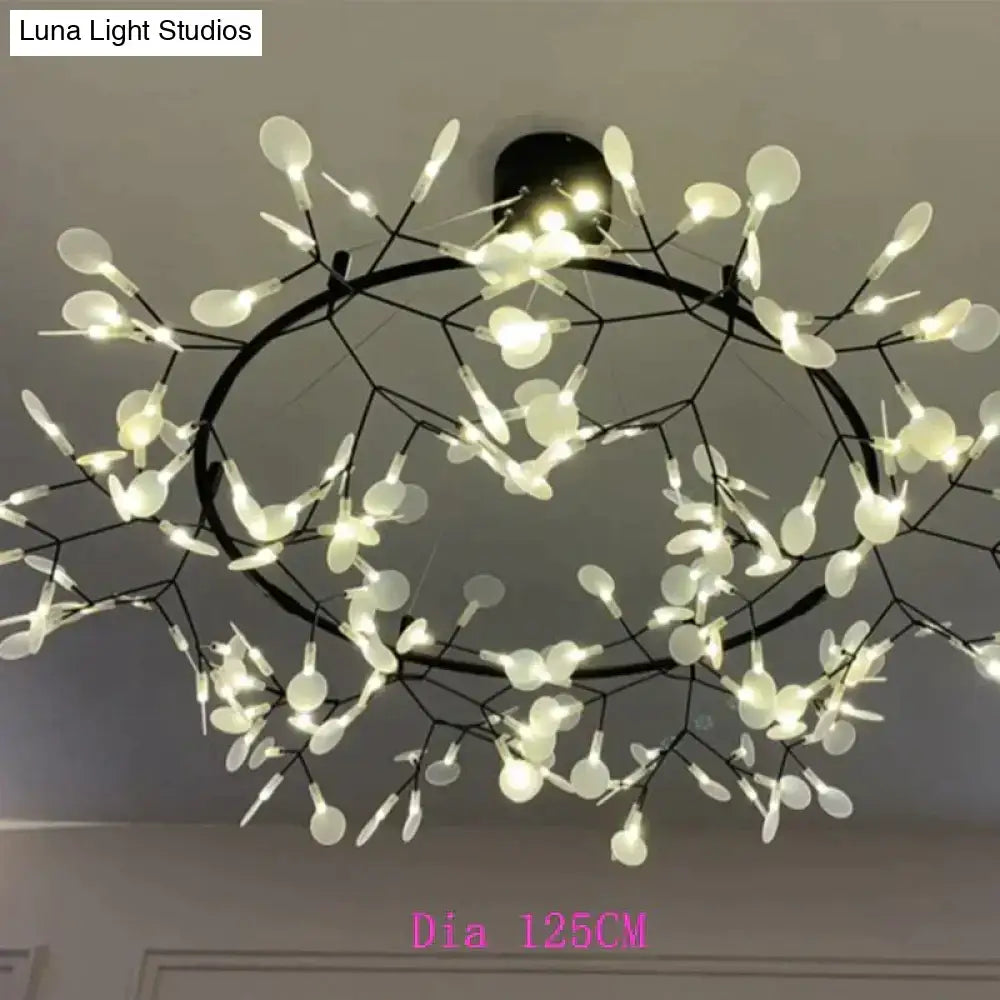 A modern led lamp pendant light with black metal frame and white spoon-shaped lights in tree branch design