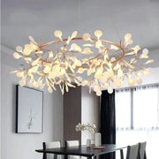 Modern copper tree branch pendant light with leaf-shaped glass orbs and led lamp for dining room illumination