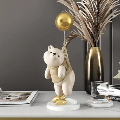 Modern cream and gold balloon polar bear resin figurine holding a metallic balloon for office desk decor