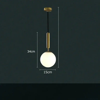 Modern cream and blue glass planet pendant light with brass-finished metal rod and frosted globe for bedroom use