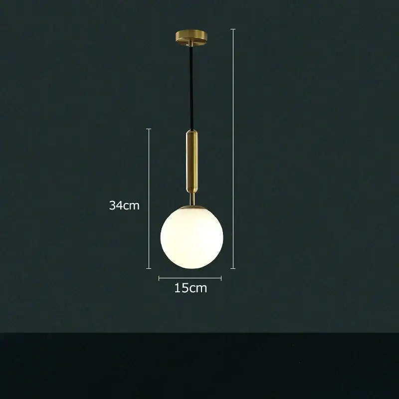 Modern cream and blue glass planet pendant light with brass-finished metal rod and frosted globe for bedroom use