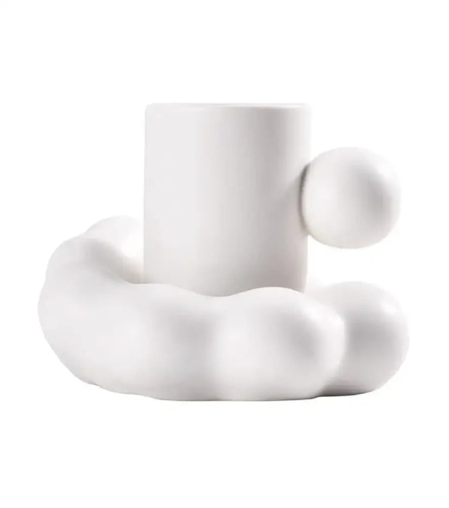 Modern cream ceramic cup and saucer set with a cloud-like base and rounded handle for elegant decorbites cotton candy use