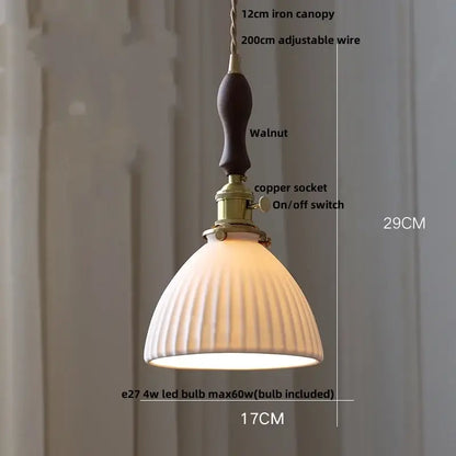 Modern cream ceramic led pendant light with warm-toned ribbed design walnut iron canopy and brass hardware decorbites ceramic led