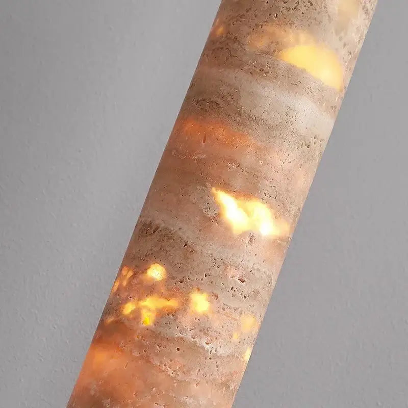 Modern cream concrete pendant light with warm yellow light source and textured surface for dining room cord pendant