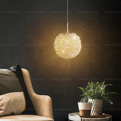Modern cream crystal round room chandelier featuring a delicate faceted golden-hued decorbites crystal round design