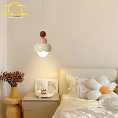 Modern cream and pink stacked resin pendant light with spherical elements for bedroom decorbites cream wind