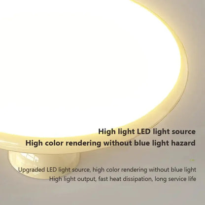 Circular cream iron nordic ceiling light with warm diffused led glow and smooth off-white plastic housing for bedroom decorbites